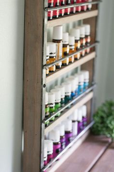 Essential Oil Display Shelf Constructed of Pine and Steel. Holds up to 32- 15ml bottles OR 36- 5ml bottles. Could also hold nail polish, trinkets, or spices! SIZE 12 x 16 1/2 inches See listing picture for specific measurement diagram. COLOR 5 stain color options available. Shown in Classic Grey. Please see the last picture for stain color options. HARDWARE Two keyholes are routed into the back for flush-mounted hanging. We recommend hanging with screws and drywall anchors, not included. SHIPPIN Shelf For Essential Oils, Essential Oil Storage Ideas, Essential Oil Display, Essential Oil Rack, Oil Display, Oil Rack, Nail Polish Display, Oil Shelf, Essential Oil Shelf