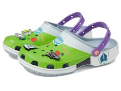 Crocs Toy Story Classic Clog - Shoes : Blue Grey/Buzz Light Year : Embark on a whimsical adventure with the Crocs Toy Story Classic Clog, where comfort meets character! These unbelievably light clogs are water-friendly, buoyant, and a breeze to clean. With ventilation ports and a secure fit, they offer 360-degree comfort. Enhance your Toy Story style by adding the Thermoplastic upper. Thermoplastic lining. EVA midsole. EVA outsole. Imported. Measurements: Heel Height: 4 5 in Weight: 6.93 oz Platform Height: 7 12 in Product measurements were taken using size Men's 2, Women's 4, width Medium. Please note that measurements may vary by size. Crocs Men, Toy Story Buzz Lightyear, Toy Story Buzz, Mens Toys, Women's Crocs, Mens Shoes Sandals, Crocs Classic Clogs, Crocs Shoes, Womens Clogs