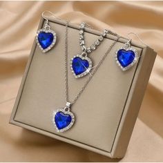 Thanks For Stopping By! While You're Here Please Take A Look At The Other Items In My Shop. Bundle And Save! About This Item: Blue Glass Heart Necklace (18") Bracelet (Adjustable 8-10") Earrings Set Rhinestone Surround Silver Tone, Jewelry Box Not Included Thank You For Looking! Condition: New With Tags Sapphire Jewelry For Valentine's Day, Elegant Blue Jewelry For Valentine's Day, Blue Jewelry For Valentine's Day Party, Blue Heart Pendant Jewelry For Party, Silver Heart-shaped Jewelry Sets For Party, Silver Heart Jewelry Sets For Party, Silver Heart-shaped Metal Jewelry Sets, Blue Heart Cut Jewelry For Party, Blue Crystal Jewelry Sets For Gifts