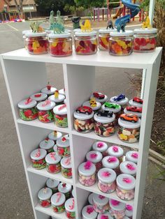 a shelf filled with lots of different types of desserts on top of each other