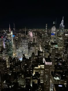 an aerial view of new york city at night from the top of the empire building