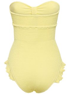 Ruffled details. Model is wearing a size01 Chic Sleeveless Lined Swimwear, Chic Lined Sleeveless Swimwear, Strapless Beach Bodysuit For Spring, Strapless Bodysuit For Beach In Spring, Chic Strapless Ruffled Swimwear, Fitted One-piece Bodysuit With Ruffles, Fitted Ruffles Bodysuit, Summer Strapless Fitted Bodysuit, Fitted Yellow Ruched Swimwear