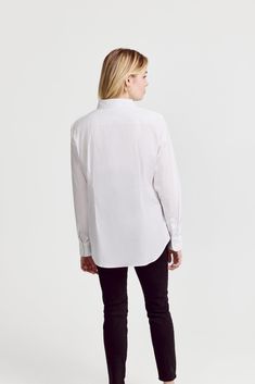 The Icon Shirt runs tailored at the waist, chest and back.  For a contemporary fit, order true size.  For a blousier fit, size up, or consider The Boyfriend Shirt for an even looser look.

 Our perfect fit cotton stretch button down. We designed our best-selling Icon Shirt to be fitted throughout, giving you a body-hugging shape yet eliminating blouse gape completely.  Our cotton stretch is sourced from a family-run mill in Spain and produced in our factory in Portugal by a local team of artisan Modern Tops With Concealed Placket, Modern Tops With Concealed Placket For Workwear, Modern Workwear Tops With Concealed Placket, Modern Tops For Workwear With Concealed Placket, Modern Tops With Shirttail Hem For Daywear, Classic Button-up Tops For Daywear, Modern Long Sleeve Tops With Concealed Placket, Modern Long Sleeve Top With Concealed Placket, Tailored Top With Concealed Placket For Workwear