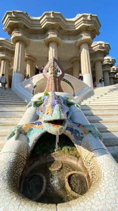 an elaborate fountain in front of a building