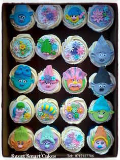 the cupcakes are decorated with sesame street characters and sea life designs on them