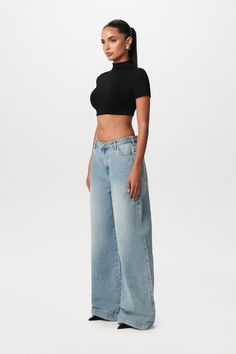 Our oversized denim wide-leg pant brings retro to the modern style. Designed with waist-button tab-adjustability for your waist preference. Front zipper with button closures and multi-pockets to complete the relaxed fit. Style with sneakers or heels to create versatile looks. Denim Collection Import 100% Cotton Oversized fit True to size Inseam: Size 27 - 33" Inseam: Size 31 - 35" Wide Leg Jean Outfits, Mh Aesthetic, Adjustable Waist Pants, Style With Sneakers, Corporate Girlie, Brand Session, Style Vision Board, Pant Outfits, Outfit Concert