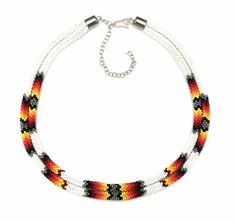 a multicolored beaded necklace on a white background