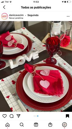 the table is set for valentine's day with red and white plates