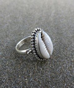 Cowrie Shell Rings / Silver Oxidized Rings / Statement Boho Rings / Seashell Ring / Handcrafted Cowrie Ring / Beach Jewelry / Mothers Gift / All rings sizes / Summer Beach Jewelry Metal:- 925 Sterling Silver Finish :- Silver Oxidized Stone:- Cowrie Shell Stone Shape : Natural Shell Ring Size - 5 To 12 Ring sizes available Benefit Of Cowrie:  They are used as a tool to save children from evil eyes and negative energies. *They are kept in the prayer room, cash box or money lockers for financial pr Cowrie Ring, Shell Rings, Lakshmi Pooja, Seashell Ring, Summer Beach Jewelry, Financial Prosperity, Oxidized Ring, Divine Power, Cash Box