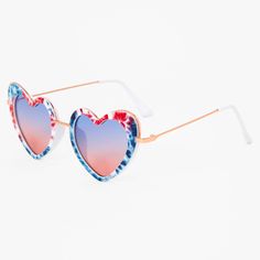 You'll "heart" the way these sunglasses are so patriotic, perfect for the 4th of July and all summer long! The heart-shaped shades with a red, white, and blue tie dye design and matching ombre lenses are a fun way to protect your eyes from the sun. Pair them with denim for a classic Americana look! Lens Color: Ombre Frame Color: Rose Gold Frame Type: Heart Dimensions: 5.5'' W x 2'' H Material: Metal, Plastic - Claire's Red, White, And Blue Tie Dye Heart Sunglasses Heart-shaped Sunglasses With Heart Print For Summer, Fun Summer Sunglasses With Heart Print, Fun Heart Print Sunglasses For Beach, Heart Print Sunglasses For Valentine's Day Beach Outing, Heart-shaped Beach Sunglasses With Gradient Lenses, Trendy Multicolor Heart-shaped Sunglasses, Casual Heart Print Sunglasses For Beach, Casual Beach Sunglasses With Heart Print, Summer Beach Sunglasses With Heart Print