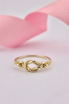 14k Solid Gold Love Knot Ring, Dainty Knot Ring for Women, Delicate Infinity Ring This solid gold dainty ring is made entirely from 14k solid gold. * Jewelry is packaged and shipped in a delicate jewelry gift box. * If you are purchasing it as a gift, please feel free to add a personal note. Anniversary, Gift For Wife, Christmas Gift Gold Kt: 14K solid gold * Available Gold Color:  * Guaranteed Authentic 14k Gold, Not Plated Or Filled * Stamp: 14K Gold Infinity Promise Stackable Rings, Yellow Gold Sterling Silver Infinity Rings, Yellow Gold Infinity Rings In Sterling Silver, 14k Gold Infinity Stackable Rings For Anniversary, Sterling Silver Infinity Ring In Yellow Gold, 14k Gold Infinity Jewelry Ring, Gold Infinity Promise Ring, 14k Gold Infinity Stackable Promise Rings, Promise Stackable Infinity Rings In 14k Gold