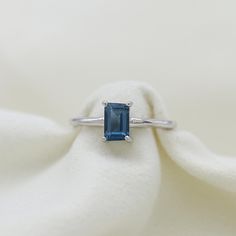 14k Gold Ring, London Topaz Gold Ring, Blue Baguette Ring, Minimalist Ring, Birthstone Ring, Blue Gemstone Ring, Personalized Gift Jewelry. ►Gemstone: London Topaz  ►Base Metal:14k Gold  ►Gross Weight - 2.5 gm ★Gemstone size: ★ Stone - 7*5 mm ★ Stone Weight- approx. 1 carat ► Band measure- ★Band measurements: approx. 1.8mm wide, approx. 1.5mm thick ♥ Packaging: All jewelry comes in a beautiful and careful packaging 🛍 If the item is going directly to the gift recipient please leave us a note dur Sapphire Topaz Ring With Prong Setting, Sapphire Color Topaz Ring With Accent Stones, Classic Blue Gemstone Birthstone Ring, Sapphire Topaz Ring With Accent Stones, Blue Rectangular Stone Ring In Fine Jewelry Style, Classic Blue Topaz Birthstone Ring With Accent Stones, Sterling Silver Rings With Rectangular Birthstone, Sapphire Rings With Topaz Accent Stones, Blue Sapphire Ring With Rectangular Stone