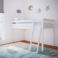 a white bunk bed sitting in a bedroom next to a window with stars on the wall