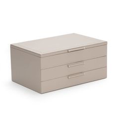 a white box with two drawers on it