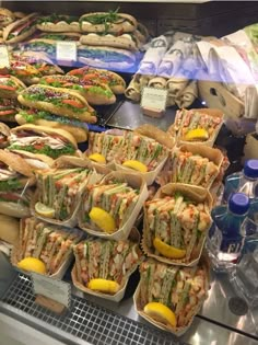 a display case filled with lots of sandwiches