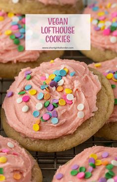 vegan lofthouse cookies with pink frosting and sprinkles on a cooling rack