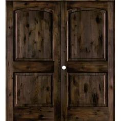 the double doors are made from wood and have two sidelights on each side,