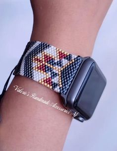 a beaded apple watch bracelet with an arrow on it