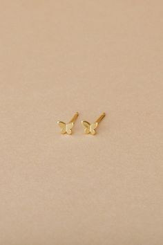 Mariposa is our tiny gold vermeil butterfly stud, the only thing better than flowers is butterflies. We love to wear our Mariposa solo or layer with a hoop. - 3D gold vermeil butterfly stud detail with butterfly closure - .5mm width, 4mm length, 1mm thick - Nickel free - Hypoallergenic Minimalist Yellow Gold Butterfly Jewelry, Delicate Gold Earrings With Butterfly Charm, Dainty Tiny Butterfly Earrings, Tiny Dainty Butterfly Earrings, Tiny Butterfly Dainty Earrings, Dainty Yellow Gold Butterfly Earrings, Everyday Gold Butterfly-shaped Jewelry, Dainty Yellow Gold Earrings With Butterfly Charm, Minimalist Gold Earrings With Butterfly Charm