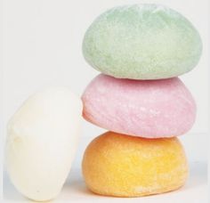 three different colored donuts stacked on top of each other