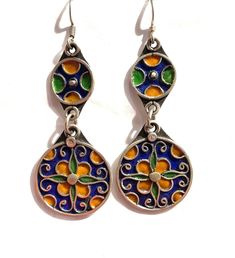 this is a beautiful pair of vintage style silver Berber enamelled earring from Morocco.  It is all handmade by the best Berber silver smith in Morocco.  The silver is over 90% Size: 2.7 inch long and one inch wide Nickel Free Enamel Dangle Earrings, Silver Metal Earrings With Meenakari, Green Enamel Earrings With Artistic Design, Silver Meenakari Earrings, Bohemian Hand-painted Enamel Jewelry, Bohemian Hand Painted Enamel Jewelry, Hand Painted Bohemian Enamel Jewelry, Silver Enamel Drop Earrings, Unique Silver Enamel Earrings