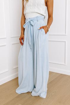 - Go with this flow in these trendy pants! - Unlined chambray material - A waistline with an elastic back, belt loops, and a removable tie closure belt - Pleated details on front - Functional side pockets - A relaxed silhouette that ends in wide floor length hemlines