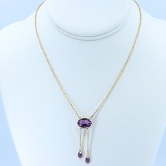 "Vintage Minimalist Lavalier Necklace in 14k Gold with Bezel Set, Oval Cut, Amethysts. This necklace bears a makers hallmark with \"rings and the letter A\", there is also a 14k Purity mark, no origin mark. Necklace measures 15.75\" Total Drop of Lavalier Pendant 1.75\" 1X - 13.6x9.8x5.85 mm Large Amethyst Oval Gem 2X - 7x4.5x3.75 mm Small Amethyst Oval Gems Total weight of necklace 0.179 Oz (78.1 g) This item is vintage. It has been cherished, worn, and preserved by possibly many over the decad Delicate Oval Pendant Necklace For Formal Occasions, Classic Drop Necklace With Delicate Chain For Formal Occasions, Classic Drop Necklace With Delicate Chain For Formal Events, Elegant Lariat Necklace With Cable Chain For Formal Occasions, Delicate Oval Necklace For Formal Occasions, Formal Yellow Gold Drop Necklace With Gemstone, Dainty Briolette Necklace For Formal Occasions, Minimalist 14k Gold Drop Necklace For Formal Occasions, Formal Yellow Gold Briolette Necklace