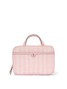 "Find VICTORIA'S SECRET Travel Toiletry Bag on Editorialist. This Victoria's Secret travel toiletry bag features two interior zip compartments, one exterior front slip pocket, and a small inner zip pocket with an optional hook for hanging. It measures 7 1/4\" H X 10 1/2\" L x 3 1/4\" W. It is perfect for storing and organizing travel essentials, including fragrances, lotions, makeup brushes, lipsticks, and more." Travel Toiletry Bag, Toiletry Bag Travel, Toiletry Bags, Christmas Wishlist, 4 H, Lipsticks, Jet Set, True Beauty, Toiletry Bag