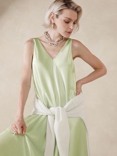 This floaty midi dress is cut with inset godet panels to increase the sweep of its skirt.  For fabric, we selected our signature silk charmeuse, a fabric we love for its beautiful drape, satin-like shine, and ease of care.  Trapeze Fit: Cut for a flowing, A-line fit.  No waist definition.  Scoop neck.  Scoop back.  Fully lined.  Trapeze Fit: Cut for a flowing, A-line fit.  No waist definition.  Sleeveless.  Midi length.  Model: Size S, 5'10" (178cm). Floaty Maxi Dress, Celery Green, No Waist, Silk Midi Dress, Silk Maxi Dress, Beautiful Drapes, Silk Charmeuse, Its Beautiful, First Look