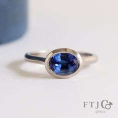 a blue ring sitting on top of a table