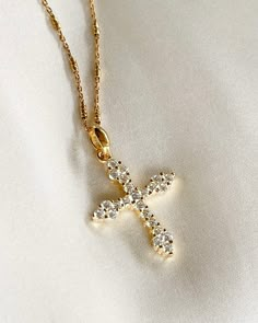 The Luxe Cross Necklace adds that perfect touch of brilliance to your look, and layers perfectly with other gold necklaces. Cross pendant is 14K gold plated silver with Cubic Zirconia, on rolo gold filled chain. Pendant: 19x25mm & 2.5mm thick. All items come in a gift box ready to gift. To see more please visit  https://www.etsy.com/shop/BijouLimon Bijou Limon jewelry collections present a romantic French spin on the latest jewelry trends. Based on the US West Coast but French at heart, Bijou Li Dazzling Gold Necklace, Elegant Gold Crystal Necklaces For Layering, Elegant Gold Crystal Necklace For Layering, Dazzling Gold Necklace With Adjustable Chain, Dazzling Gold Pendant Necklace, Spiritual Gold Crystal Necklaces For Layering, Dainty Gold-plated Necklace With Jewels, Elegant 14k Gold-filled Cross Pendant Necklace, Delicate Gold Jeweled Necklaces