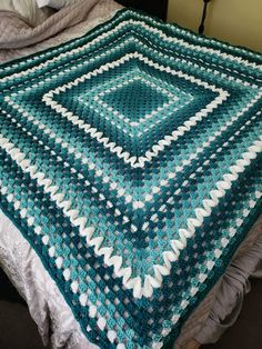 Handmade crochet throw with white detailing. This would make a lovely addition to anywhere you like to sit. This blanket is lightweight but holds in warmth. Size is 5ft by 5ft. Machine washable at any temperature. Turquoise Crochet Blanket, Blue And Green Crochet Blanket, Teal Crochet Blanket, Teal Blanket, Crochet Blanket Colors, Teal Crochet, Blanket Throws, Blanket Ideas, Turquoise And Purple