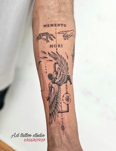 a man with a tattoo on his arm that says meneto mori and an eagle