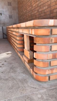 a pile of bricks sitting on top of a cement floor