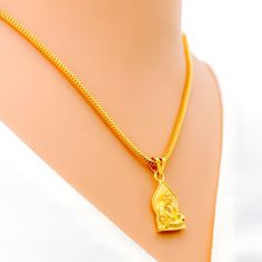 This attractive pendant, exquisitely crafted from 22k gold and weighing 3.2 grams, features a finely engraved depiction of Sai Baba set against a luminous yellow gold finish. The pendant has a length of 0.9 inches, making it both noticeable and modest in size, ideal for daily wear. Perfect for devotees who wish to keep Sai Baba close to their hearts, this pendant combines spiritual devotion with elegant craftsmanship, offering a timeless piece that embodies grace and serenity. PRODUCT DETAILS Gold Purity(karat): 22k Gold Weight(grams): 3.2 Item Finish: Yellow Gold Pendant Length: 0.9" Chain: Not Included 22k Gold Amulet Locket Jewelry, 22k Gold Necklaces For Puja, Gold Necklace With Large Pendant For Festivals, Gold Necklace With Detachable Pendant For Ceremonial Use, Gold Necklace With Detachable Pendant For Ceremonial Occasions, Gold Necklaces With Large Pendant For Festivals, 22k Gold Amulet Pendant Jewelry, 22k Gold Locket Temple Necklace, 22k Gold Locket Necklace In Temple Jewelry Style