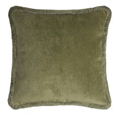 a green velvet pillow with fringe trims on the front and back of the pillow