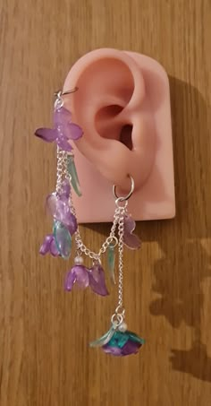 Introducing our gorgeous handmade butterfly and rose earrings. These are available in purple, red and pink, with the choice of helix and earring or if you wish just dangle earrings. These butterfly designs are intricately sculpted, capturing the ethereal essence of these enchanting creatures with wings poised in mid-flight, accentuated by subtle, shimmering details that catch the light with every movement. Complementing the butterflies, the rose motifs are artfully shaped, showcasing the intrica Fantasy Style Pierced Cartilage Earrings For Gift, Handmade Purple Clip-on Earrings As Gift, Handmade Purple Clip-on Earrings For Gift, Purple Dangle Flower Earrings For Pierced Ears, Unique Pierced Dangle Flower Earrings, Handmade Dangle Cartilage Earrings As Gift, Handmade Dangle Cartilage Earrings For Gift, Unique Dangle Flower Earrings, Gift Dangle Cartilage Earrings