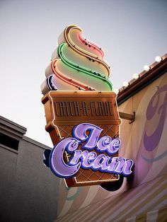 the ice cream sign is lit up for customers to enjoy it's flavored flavors