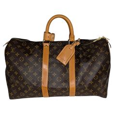 From the 1995 Collection; Louis Vuitton Weekender Bag in brown coated canvas with the iconic LV logo monogram and brass hardware. It features dual rolled handles, canvas lining and a zip closure at top. Comes with an Entrupy Certificate for peace of mind. Est. Retail $2,200. Designer: Louis Vuitton Material: Monogram canvas; cowhide leather Date/Authenticity Code: SD0975 Production Year: July 1995 in the U.S.A. Measurements: 17.7"W x 10.6"H x 7.9"D Drop: 4" Closure/Opening: 2-way zip Interior Li Lv Keepall 45, Louis Vuitton Weekender, Louis Vuitton Keepall 45, Keepall 45, Lv Logo, Hermes Kelly Bag, Louis Vuitton Vintage, Cartier Panthere, Leather Roll