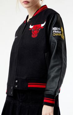 Level up your game-day style with the Chicago Bulls Varsity Jacket from Pro Standard. This iconic piece seamlessly blends classic varsity vibes with the fierce spirit of the Bulls, ensuring you stand out in the crowd with a touch of Windy City swagger. 


	Solid color varsity jacket
	Quilted lining
	Full zipper front closure
	Long sleeves
	Side hand pockets
	Striped ribbed collar, cuffs, and hem
	Bulls chenille embroidery and branding
	100% polyester
	Machine washable
	Model is wearing a size small
	Model measurements: 5’8” height, 30.5” bust, 24.5” waist, 35.5” hips Chicago Bulls Outfit, Chenille Embroidery, Windy City, Chicago Bulls, Pacsun, Front Zipper, Varsity Jacket, Chicago, Solid Color