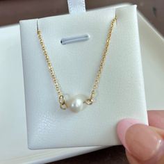 Enhance your feminine grace with our Single Pearl Necklace. Made with a dainty, cute design, this necklace will add a touch of girly elegance to any outfit. Stand out and make a statement with this unique and sophisticated accessory. 15 inches long + 2 inches ext 18K PVD gold plated stainless steel Fresh Water Pearl Pendant Non Tarnish And Water Resistant Dainty Pearl Necklace With Clavicle Chain For Gift, Dainty Pearl Clavicle Necklace Gift, Dainty Pearl Charm Necklaces, Delicate Necklace With Simple Design For Gifts, Delicate Simple Necklace For Gift, Delicate Simple Design Necklace For Gift, Elegant Hypoallergenic 14k Gold Necklace, Dainty Adjustable Pearl Necklace For Gift, Dainty Adjustable Pearl Necklace Gift