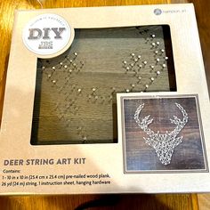 the deer string art kit is in its box