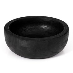 a black bowl sitting on top of a white table