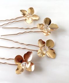 Enhance your special occasion hairstyle with these exquisite flower hair pins. Each pin features a stunning gold flower with a delicate crystal centre, meticulously hand-wired onto a gold hairpin. This set includes four beautiful hair pins, perfect for brides, bridesmaids, flower girls, or any special event. These flowers can be made with a pearl centre instead, please message to enquire. Wedding Baubles, Decorative Hair Pins, Gold Hair Piece, Occasion Hair, Flower Hair Pins, Gold Hair Pin, Special Occasion Hairstyles, Bridesmaid Hair Accessories, Gold Hair Accessories