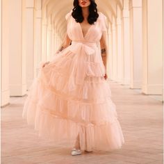 This Stunning Piece Features A Tulle Material, Adjustable Ties On The Straps And Waist, A Smocked And Stretchy Waist, A Petticoat, Lining And A Beautiful Tiered Yet Ruffled Skirt. It Is Nwt And In Perfect Condition. My Model Is Wearing A Size Small. She Is 5’4” With A 32c Bust And 25” Waist. Summer Tulle Maxi Dress With V-neck, Spring Tulle Maxi Dress In Ball Gown Shape, Spring Tulle Ball Gown Maxi Dress, Spring Tulle Maxi Ball Gown, Floor-length Summer Tulle Maxi Dress, Floor-length Tulle Evening Dress For Summer, Summer Floor-length Tulle Evening Dress, Pink Maxi Tulle Skirt Dress, Summer Bridesmaid Evening Dress With Tulle Skirt