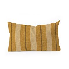 a yellow and brown striped pillow on a white background