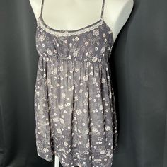 Babydoll Slip With Empire Waist, Adjustable Straps, Sheer Throughout, And Delicate Racerback Style. Size Xs Gray Cotton Sleepwear For Bedtime, Gray Spring Sleepwear, Cute Sleeveless Sleepwear With Floral Print, Cute Floral Print Sleeveless Sleepwear, Victoria's Secret Lace Trim Cami Sleepwear, Victoria's Secret Cami Sleepwear For Loungewear, Victoria's Secret Spaghetti Strap Loungewear Top, Fitted Gray Sleepwear For Loungewear, Gray Fitted Sleepwear For Loungewear