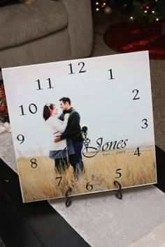 a clock with a photo of a couple kissing on the face and numbers below it