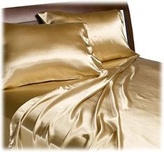 Enjoy a luxuriously smooth slumber with this complete set of satin sheets for Queen beds in a fashionable solid gold hue. This set includes one flat sheet, one fitted sheet, and two standard-sized pillow cases. These shiny, silky sheets have a sublimely smooth touch to the hand, and they're made of 100 percent woven polyester satin. The fitted sheet has elastic all the way around, and it offers a pocket depth of 14 inches that will accommodate mattresses up to 17 inches deep. Both the flat sheet and the pillowcases have a 4-inch hem. Machine wash and tumble dry on the gentle setting. Complete set of sheets for Queen beds in solid gold; includes one flat sheet, one fitted sheet, and two standard-sized pillowcases 100-percent woven polyester satin is smooth and silky, with lustrous sheen for Silk Bed Sheets, Gold Sheets, Gold Bed, Silk Sheets, Satin Bedding, Satin Sheets, Gold Bedroom, Silk Bedding, Sheet Sets Full