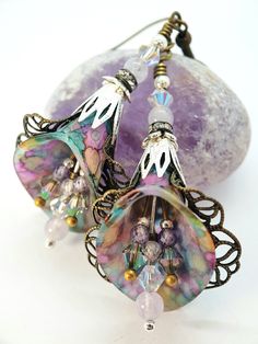 Purple Rainbow Crystal Flower Earrings ~ Victorian Earrings ~ Handmade Dangle Drop Flower Earrings, Boho Hippie Art-Nouveau Vintage Style, Unique Gift For Her. ~Victorian Chic ~ ♡ These are a beautiful pair of vintage Victorian inspired hand painted Lucite Lily flower earrings. I have painted the Lucite in the colours of the rainbows. The lightly painted lucite is wrapped in lacy Brass and Bronze filigree and findings. Which goes wonderfully with the delicate look of the Swarovski Crystals in Pa Vintage Jewelry Repurposed, Polymer Clay Flower Jewelry, Victorian Earrings, Purple Rainbow, Rainbow Flower, Earrings Handmade Dangle, Chic Earrings, Rainbow Crystal, Pink Rainbow